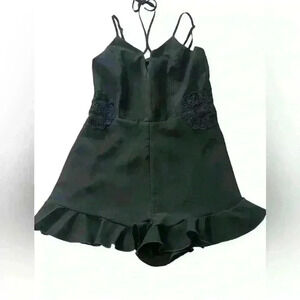 Black Romper Embroidered floral design , ruffle hem, zip up adjustable straps